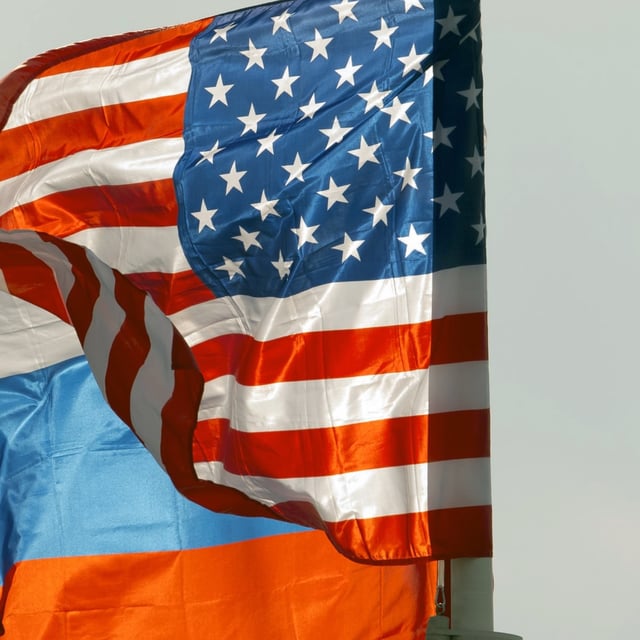 FILE - U.S. and Russian national flags wave on the wind in Moscow's Vnukovo airport, Russia, April 11, 2017 to welcome a U.S. dignitary. (AP Photo/ Ivan Sekretarev, file)