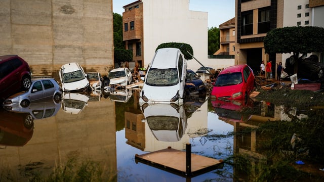 Flooded cars piled up are pictured in Valencia, Spain, Thursday, Oct. 31, 2024. (AP Photo/Manu Fernandez)
