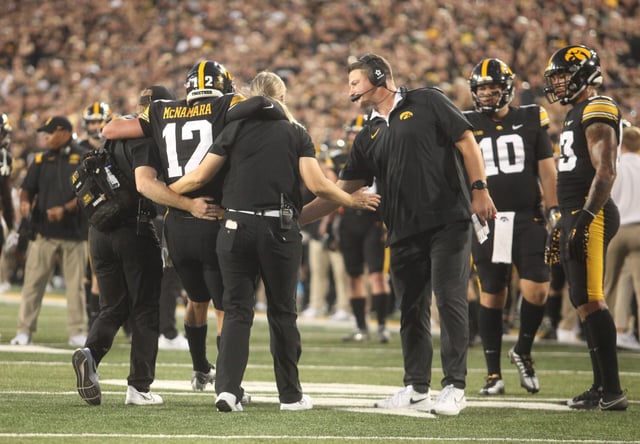 IOWA CITY, IOWA- SEPTEMBER 30: Quarterback Cade McNamara #12 of the Iowa Hawkeyes is helped of the field after an injury during the first half against the Michigan State Spartans at Kinnick Stadium on September 30, 2023 in Iowa City, Iowa. (Photo by Matthew Holst/Getty Images)