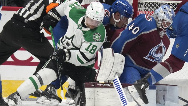 Dallas Stars center Sam Steel, front left, tries to put the puck past Colorado Avalanche goalie Alexander Georgiev (40) in the third period of a preseason NHL hockey game Sunday, Oct. 1, 2023, in Denver. (AP Photo/David Zalubowski)