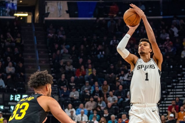 San Antonio Spurs center Victor Wembanyama (1) shoots over Utah Jazz guard Johnny Juzang (33), during the first half of an NBA basketball game, Thursday, Oct. 31, 2024, in Salt Lake City.