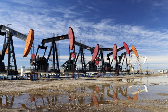 Oilfield pumpjacks, belonging to Suede Energy, work producing crude oil on wells near Gem, Alta., on Sept. 24, 2024. 