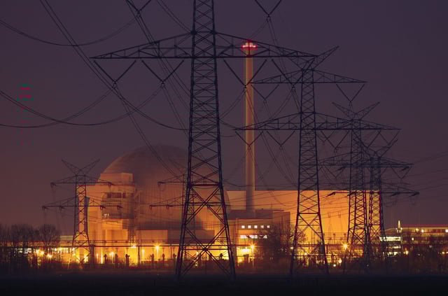 STADLAND, GERMANY - MARCH 21: Electricity pylons stand in a row leading to the Unterweser nuclear power plant on March 21, 2011 near Stadland, Germany. The Unterweser plant is among seven nuclear power reactors built before 1980 that the government of German Chancellor Angela Merkel has chosen to shut down for three months for a heightened safety and security review following the disaster at the Fukushima plant in Japan. Merkel is fending off criticism for the move, which represents a radical reversal of her government's previous policy, citing new circumstances due to the Fukushima meltdown. Nuclear power has long been a highly charged, controversial topic in Germany and opponents are seizing on the new political climate to push for a rapid abandonment of nuclear energy. (Photo by Sean Gallup/Getty Images)