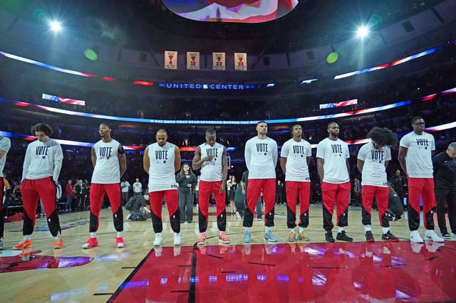 The Chicago Bulls stand for the national anthem wearing Vote T-shirts before their game against the Utah Jazz on Monday.