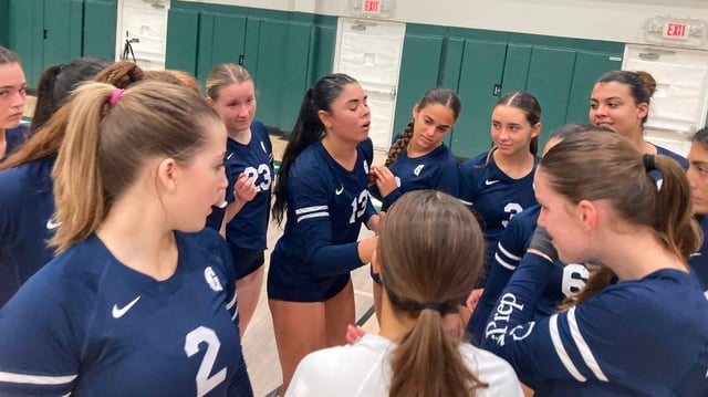 Gulliver volleyball senior Julie Rose-Rivera (middle) fires up her teammates during Tuesday’s victory over Pine Crest in the Region 4-3A final in Fort Lauderdale, Fla.