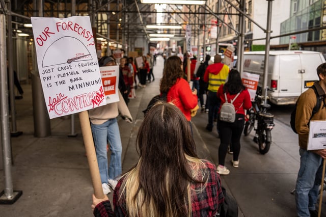 Members of The New York Times Tech Guild protest outside of the New York Times headquarters building in New York City on Nov. 4, 2024.