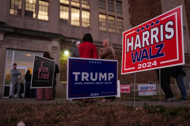 Voters wait in line to cast their ballots at the Kingston Armory in Wilkes-Barre, Pa, Tuesday, Nov. 5, 2024. (AP Photo/Matt Rourke)