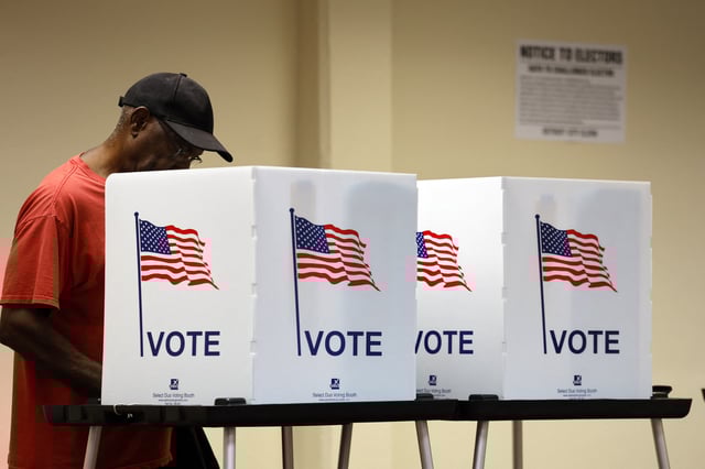 People cast their in-person early ballot for the 2024 general election at the Northwest Activities Center on Oct. 29, 2024 in Detroit, Michigan.