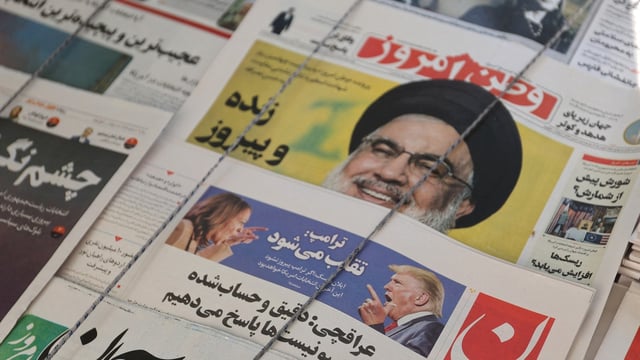 A newspaper with a picture of Republican presidential nominee and former U.S. President Donald Trump and Democratic presidential nominee U.S. Vice President Kamala Harris is seen in Tehran, Iran November 6, 2024.