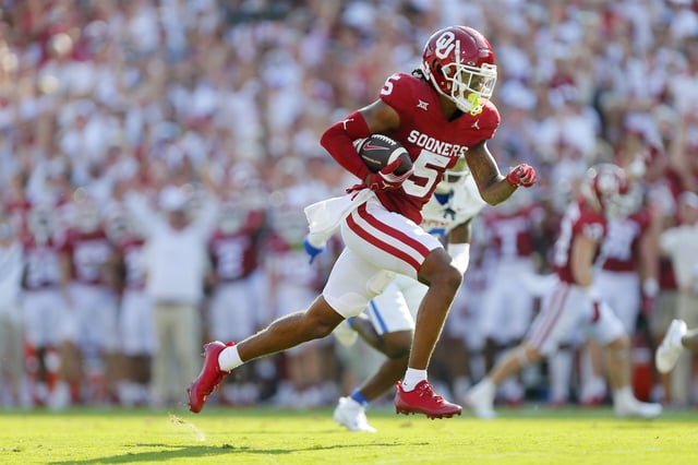 Wide receiver Andrel Anthony #5 of the Oklahoma Sooners runs with a 29-yard touchdown catch against the SMU Mustangs in the first quarter at Gaylord Family Oklahoma Memorial Stadium on September 9, 2023 in Norman, Oklahoma.