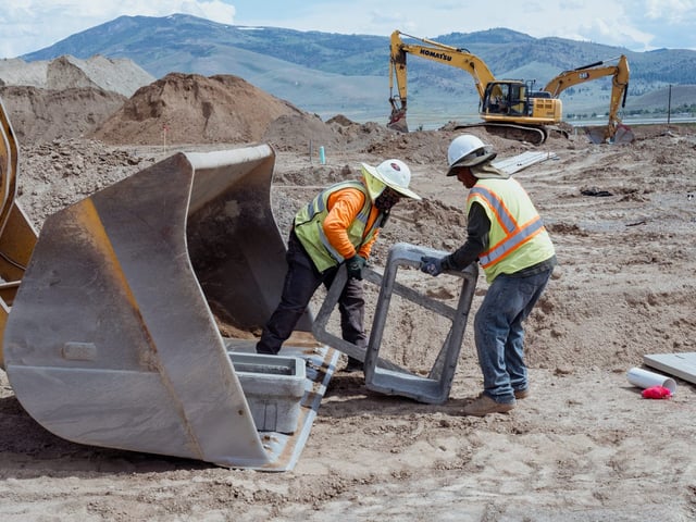 Workers are seen at a construction site where 42 new home units are being built by Lifestyle Homes housing developer in Cold Springs, Nevada