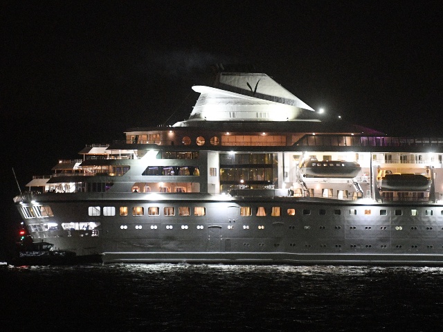 The Villa Vie Residences' Odyssey cruise ship finally departs from the harbor on September 30, 2024 in Belfast, Northern Ireland. The Odyssey was docked in Belfast for outfitting before commencing on a year-long cruise but further repairs left it in port for five months. Passengers who remained with the ship have made Belfast their home while waiting to embark on their round-the-world adventure. (Charles McQuillan/Getty)