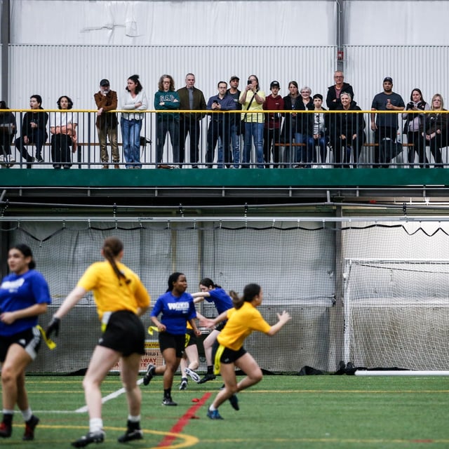 Parents watch a Blue Bombers High School Girls Flag Football League game between Elmwood and CSLR in Winnipeg, Wednesday, April 10, 2024. THE CANADIAN PRESS/John Woods