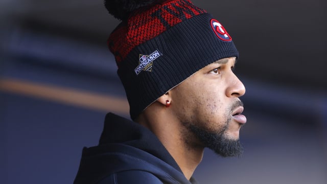 Minnesota Twins' Byron Buxton watches from the dugout in the seventh inning of Game 3 of an American League Division Series baseball game against the Houston Astros, Tuesday, Oct. 10, 2023, in Minneapolis. (AP Photo/Bruce Kluckhorn)