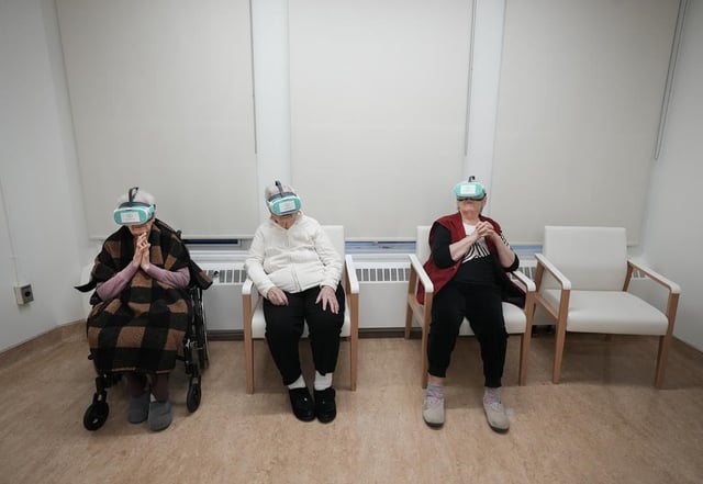 Seniors watch virtual reality as an activity at the Ivan Franko Long-Term Care Home, a Ukrainian cultural home in Toronto on Wednesday, April 3, 2024. Ontario is proposing a pilot project to tweak long-term care priority rules in order to address a problem of declining and mismatched admissions to the province's cultural homes. THE CANADIAN PRESS/Nathan Denette