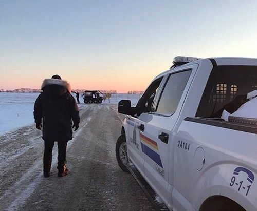 RCMP officers are shown near the town of Emerson, Man., on Wednesday Jan. 19, 2022. 