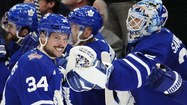 Toronto Maple Leafs' Auston Matthews (34) celebrates his goal against the Montreal Canadiens with teammates during the third period of an NHL hockey game Wednesday, Oct. 11, 2023, in Toronto. (Frank Gunn/The Canadian Press via AP)