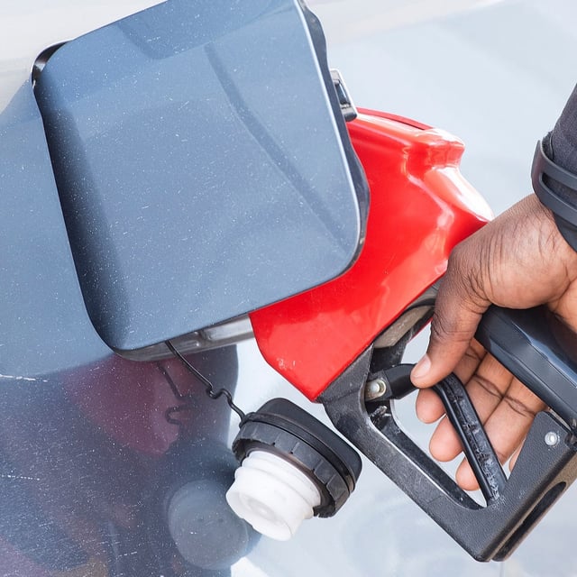 Canadians living in provinces where the federal carbon tax is collected are expected to receive their first Climate Action Incentive rebate today. A man pumps gas in Montreal, Friday, March 4, 2022. THE CANADIAN PRESS/Graham Hughes