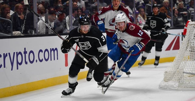 Oct 11, 2023; Los Angeles, California, USA; Los Angeles Kings defenseman Matt Roy (3) plays for the puck against Colorado Avalanche center Ryan Johansen (12) during the first period at Crypto.com Arena. Mandatory Credit: Gary A. Vasquez-USA TODAY Sports
