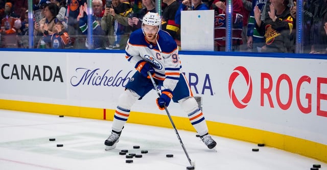 Oct 11, 2023; Vancouver, British Columbia, CAN; Edmonton Oilers forward Connor McDavid (97) handles the puck during warm up prior to a game against the Vancouver Canucks at Rogers Arena. in the first period at Rogers Arena. Mandatory Credit: Bob Frid-USA TODAY Sports