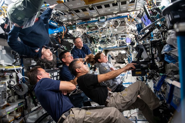 Expedition 68 crew members participate in an evening conference with International Space Station mission controllers on the ground. Credit: NASA