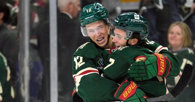 Oct 12, 2023; Saint Paul, Minnesota, USA; Minnesota Wild defense Brock Faber (7) celebrates his goal against the Florida Panthers with forward Matt Boldy (12) during the first period at Xcel Energy Center. Mandatory Credit: Nick Wosika-USA TODAY Sports