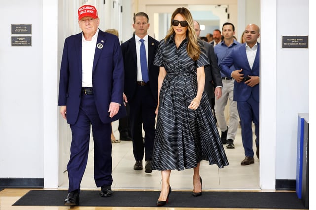 PALM BEACH, FLORIDA - NOVEMBER 05: Republican presidential nominee former President Donald Trump and his wife Melania Trump depart after casting their votes at a polling place in the Morton and Barbara Mandel Recreation Center on Election Day, on November 05, 2024 in Palm Beach, Florida. Trump will hold an Election Night event at the Palm Beach Convention Center. (Photo by Chip Somodevilla/Getty Images)
