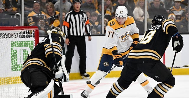 Oct 14, 2023; Boston, Massachusetts, USA; Nashville Predators right wing Luke Evangelista (77) attempts a shot against Boston Bruins goaltender Jeremy Swayman (1) during the first period at the TD Garden. Mandatory Credit: Brian Fluharty-USA TODAY Sports