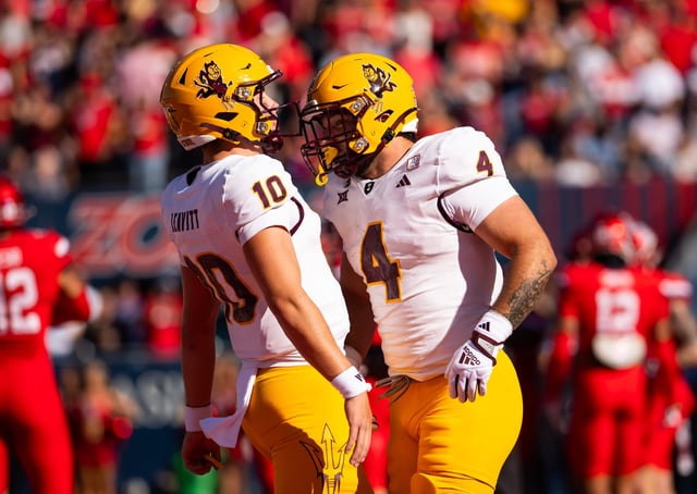 Arizona State Sun Devils running back Cam Skattebo (4) celebrates with quarterback Sam Leavitt (10) after scoring a touchdown against the Arizona Wildcats in the first half during the Territorial Cup at Arizona Stadium in Tucson on Nov. 30, 2024.