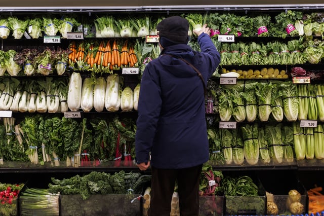 Almost two-thirds of Canadians say they have switched their primary grocery store in the past year to score better deals. A customer shops for produce at a grocery store In Toronto on Friday, Feb. 2, 2024. 
