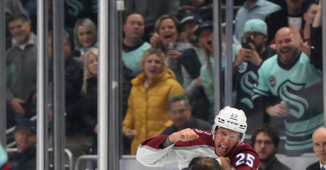 Oct 17, 2023; Seattle, Washington, USA; Colorado Avalanche right wing Logan O'Connor (25) and Seattle Kraken right wing Jordan Eberle (7) fight during the first period at Climate Pledge Arena. Mandatory Credit: Steven Bisig-USA TODAY Sports
