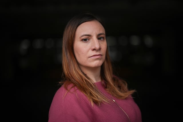 Natalie Lipschultz, 39, poses for a photograph in Burnaby, B.C., Thursday, Dec. 5, 2024. When factoring in her out-of-pocket expenses, lost wages and time costs, Lipschultz estimates her cancer diagnosis has cost her around $20,000 over the last 6 years. She now speaks out as an advocate focused on the early onset community. 