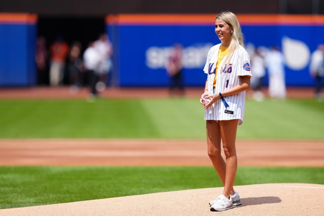Haliey Welch throws out the first pitch at an MLB baseball game.