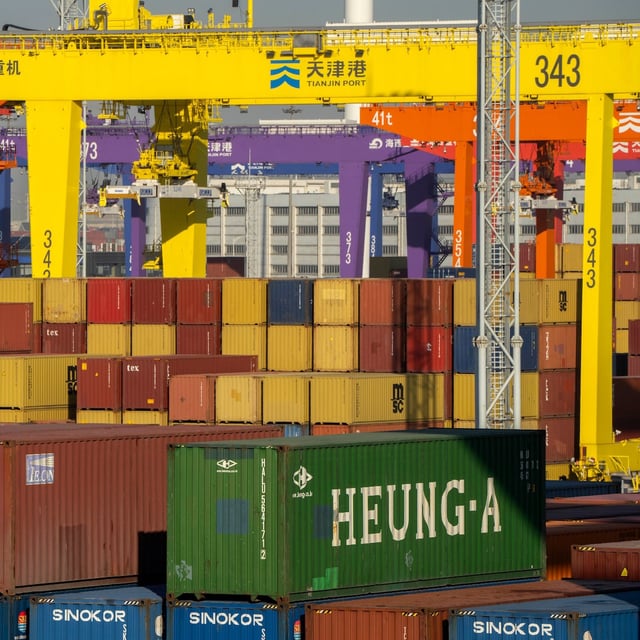 FILE - Shipping containers are stacked at a port in Tianjin, China, Jan. 16, 2023. (AP Photo/Mark Schiefelbein, File)