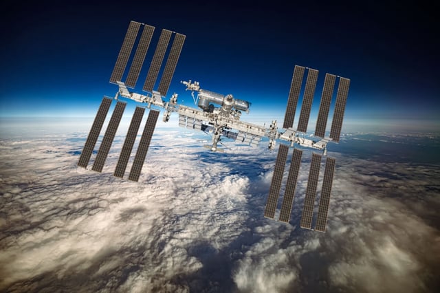 International Space Station over the planet earth. Elements of this image furnished NASA. (ID 200693085 © Andreyi Armiagov | Dreamstime.com)
