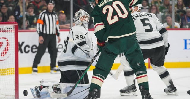Oct 19, 2023; Saint Paul, Minnesota, USA; Minnesota Wild left wing Pat Maroon (20) tries to tap a loose puck in the net, defended by Los Angeles Kings goaltender Cam Talbot (39) in the first period at Xcel Energy Center. Mandatory Credit: Matt Blewett-USA TODAY Sports