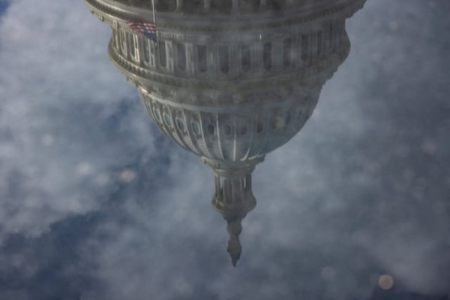 The U.S Capitol is reflected after U.S, President-elect Donald Trump called on U.S. lawmakers to reject a stopgap bill to keep the government funded past Friday, raising the likelihood of a partial shutdown, on Capitol Hill in Washington, U.S., December 19, 2024. REUTERS/Anna Rose Layden