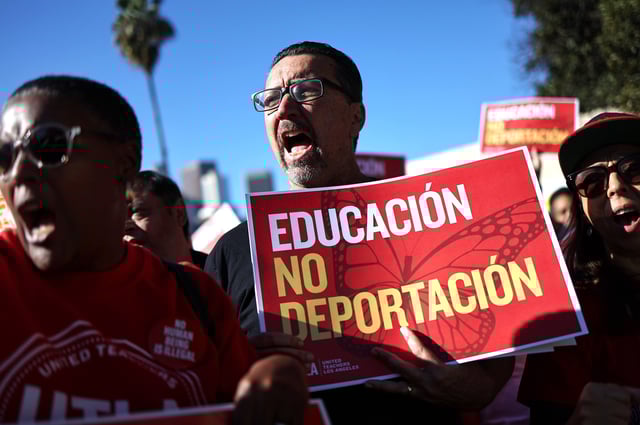 Immigrant rights supporters chant before they march to an ICE detention center on International Migrants Day on Dec. 18, 2024, in Los Angeles, California. The march was led by The Coalition for Humane Immigrant Rights of Los Angeles (CHIRLA), with marchers calling for President Biden to protect immigrant families ahead of President-elect Trump's planned wave of migrant deportations.