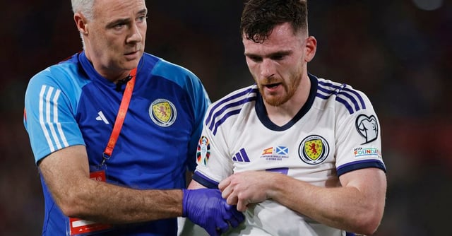 Soccer Football - Euro 2024 Qualifier - Group A - Spain v Scotland - Estadio de La Cartuja, Seville, Spain - October 12, 2023 Scotland's Andy Robertson walks off the pitch after sustaining an injury REUTERS/Marcelo Del Pozo/File Photo