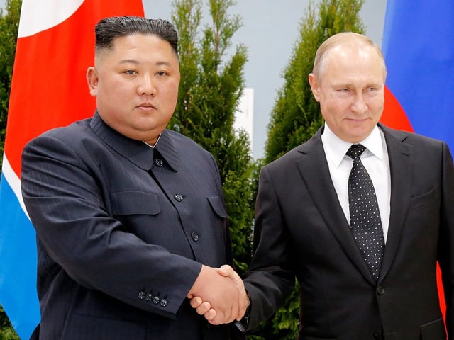 Russian President Vladimir Putin, and North Korea's leader Kim Jong Un shake hands during their meeting in Vladivostok, Russia, on April 25, 2019.