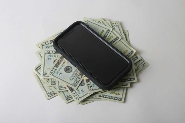 cell phone and cash bills, Dave