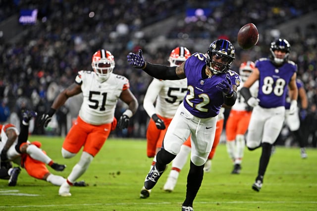 Cleveland Browns defensive tackle Michael Hall Jr. (51) chases Baltimore Ravens running back Derrick Henry (22) as he goes for a catch Saturday, Jan. 4, 2025, in Baltimore.