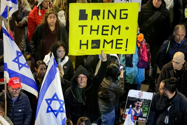 Supporters of the Israeli hostages demonstrate in Tel Aviv for a deal to bring them home.
