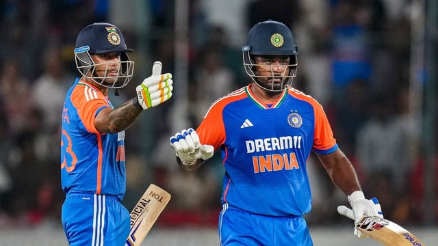 India's Sanju Samson celebrates with captain Suryakumar Yadav 