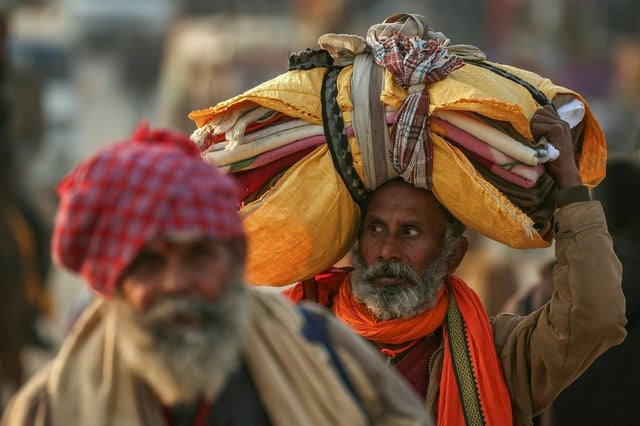 Hindu pilgrims arrive at Sangam, the confluence of Ganges, Yamuna and mythical Saraswati rivers, ahead of the  Kumbh Mela festival