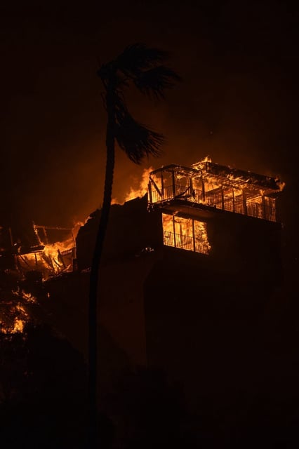 A home is engulfed in flames in the Pacific Palisades neighborhood in California on Jan. 8, 2025.