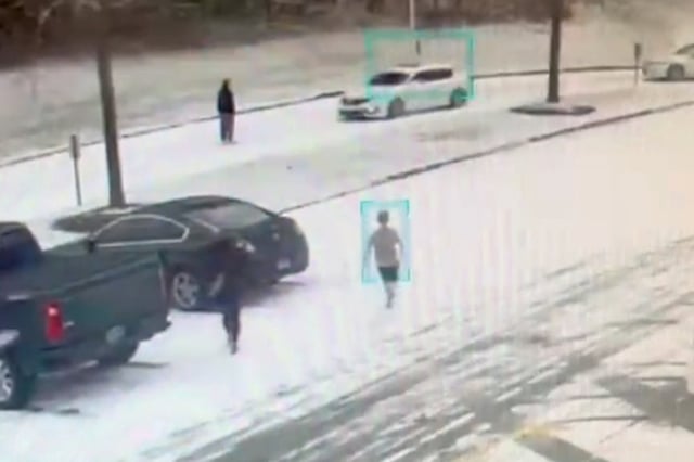 Exterior surveillance footage shows a man standing in the path of a vehicle that did not slow down.