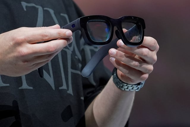Mark Zuckerberg holds a pair of Orion AR glasses during the Meta Connect conference, on Sept. 25, 2024, in Menlo Park, Calif. (AP Photo/Godofredo A. Vásquez, File)