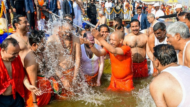 Prayagraj: Uttar Pradesh Chief Minister Yogi Adityanath, with his Cabinet colleagues, takes a holy dip at the Sangam during the Maha Kumbh Mela 2025 in Prayagraj, Uttar Pradesh.