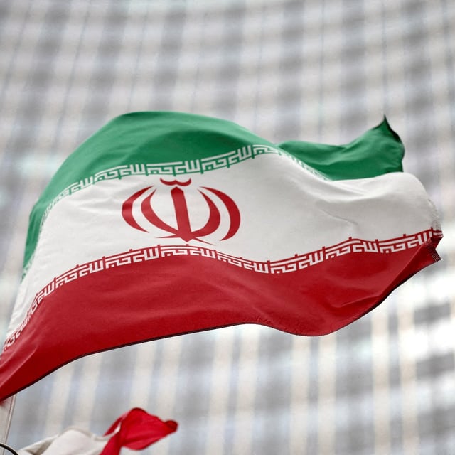 FILE PHOTO: Iranian flag flies in front of the UN office building, housing IAEA headquarters in Vienna, Austria, May 24, 2021. REUTERS/Lisi Niesner/File Photo